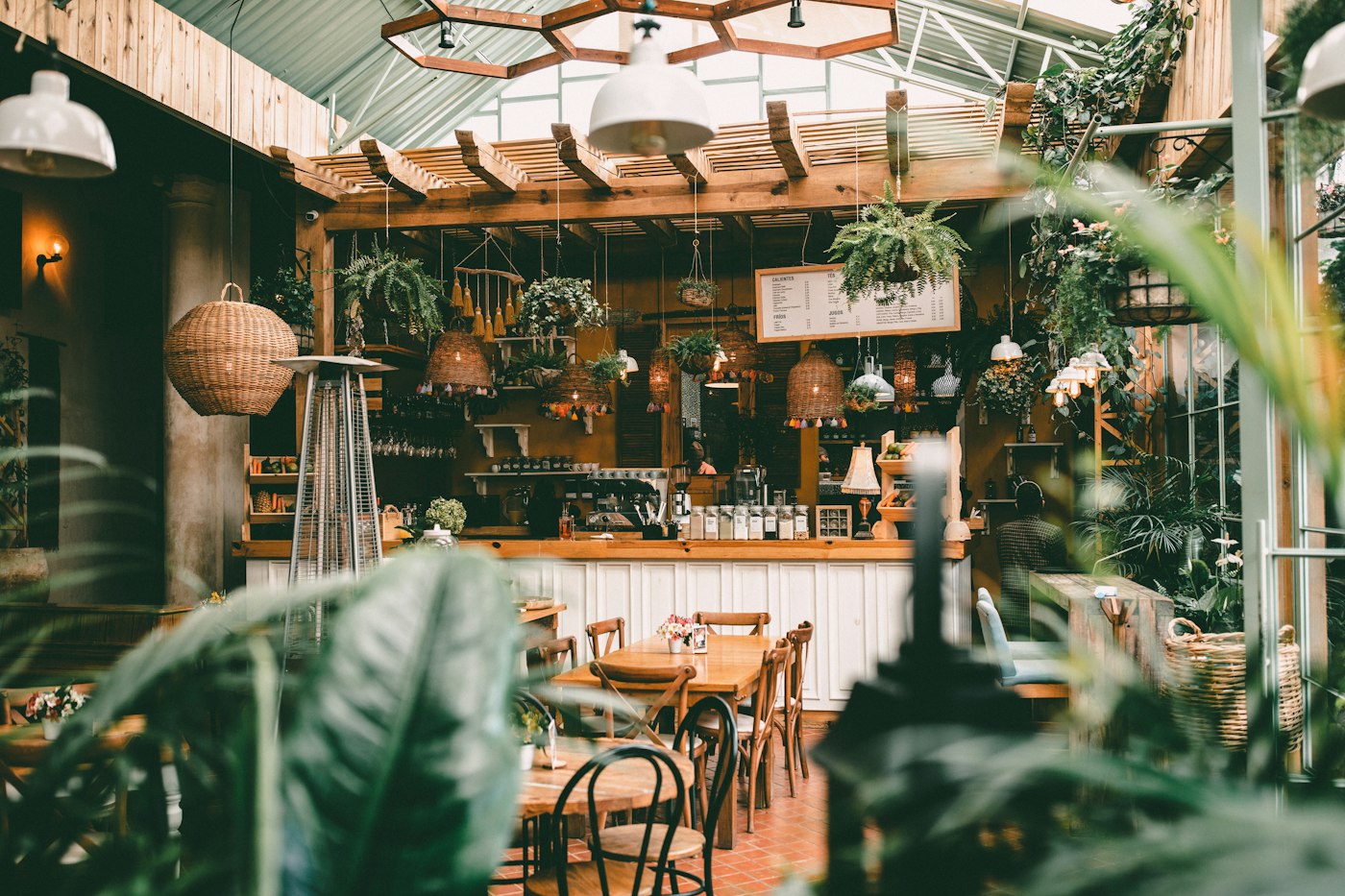 A warm, plant-filled neighborhood café